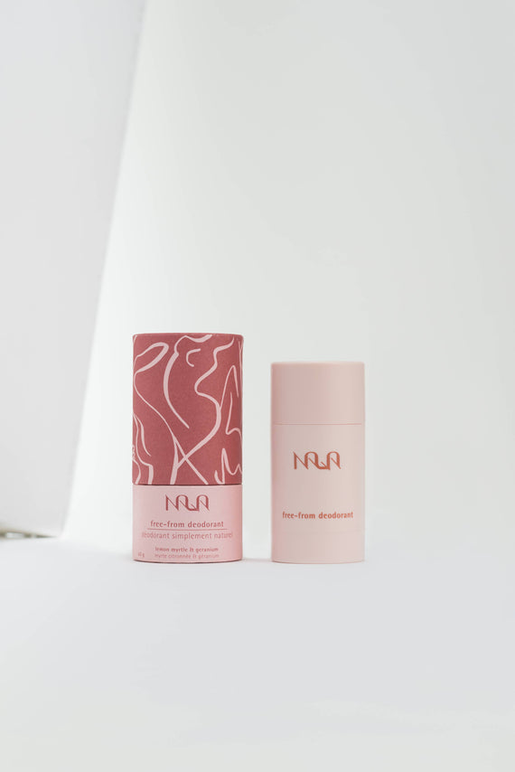 Pink cylindrical plastic natural deodorant tube sitting next to it’s decorative cardboard box on a white background