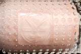 Close up of jelly product in bottle showing pink shimmer