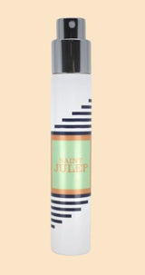 thin cylindrical perfume spray bottle with green label
