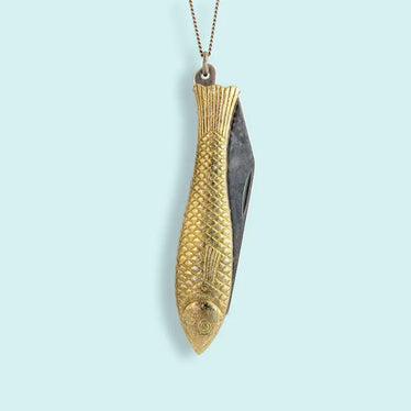 brass fish engraved with scales, tail, fins, and face, that is also a fold out pocket knife￼