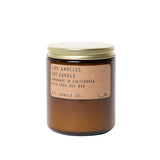 Brown amber glass jar with a screwtop lid and a brown paper label on a neutral background
