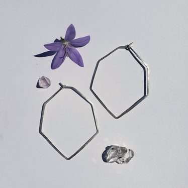 Small hexagons hoops on white background showing geometric shape with pointed bottom