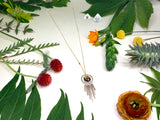 Hexagon fringe necklace on white background with decorative flowers showing long length and one single cutting smoky quartz bead