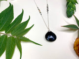 Black onyx in sterling silver chain drop necklace on white background