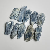 blue kyanite crystals laying flat at a different angle showing the light bouncing 