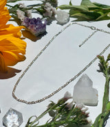 Shot of small silver Figaro chain necklace showing size and length