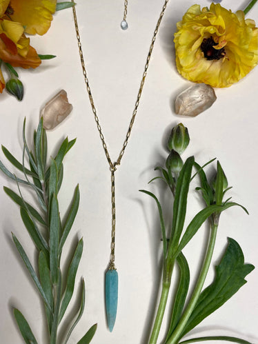 small gold box chain with amazonite okra shaped stone hanging off of a small length of chain from the middle 