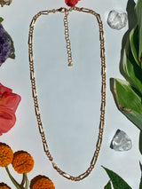 Full size Figaro chain necklace featuring a clasp and cheater chain with small opal beads connecting￼