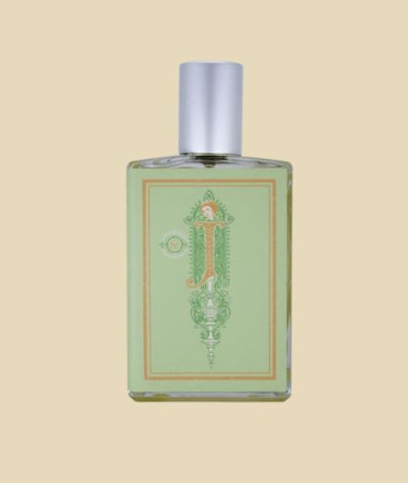 flat rectangular perfume bottle with paper label resembling book cover