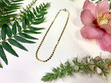 Sequin chain necklace with decorative flowers