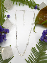 Stone and sequin necklace shows silver sequin chain segments and raw Herkimer diamonds