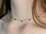 Gold choker with small lapis beads