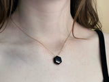 Dainty gold necklace with black onyx hexagon stone in the middle