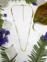Stone and sequin necklace shows segments of gold sequin Shane and raw Herkimer diamond points