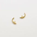 Gold arch studs with tiny moonstone set on the bottom